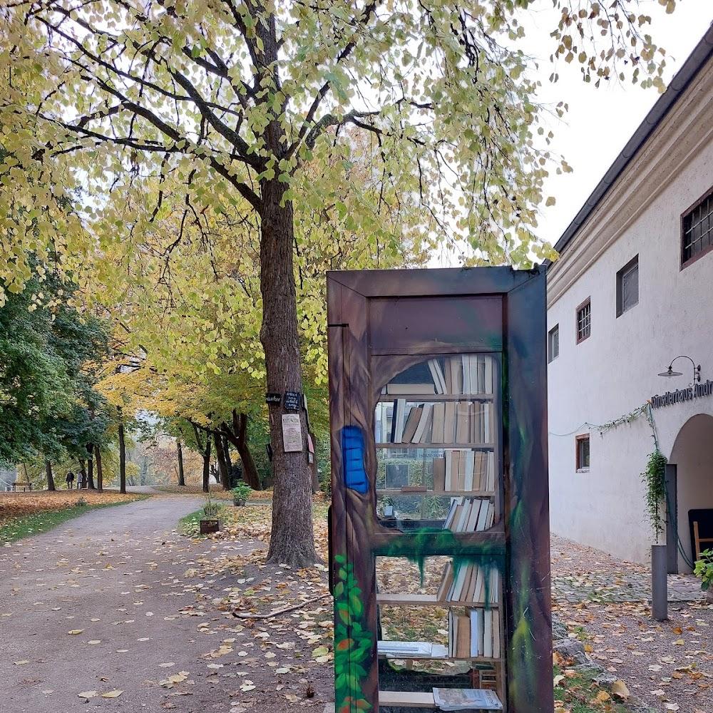 A tree-covered bookcase painted on a wooden door.